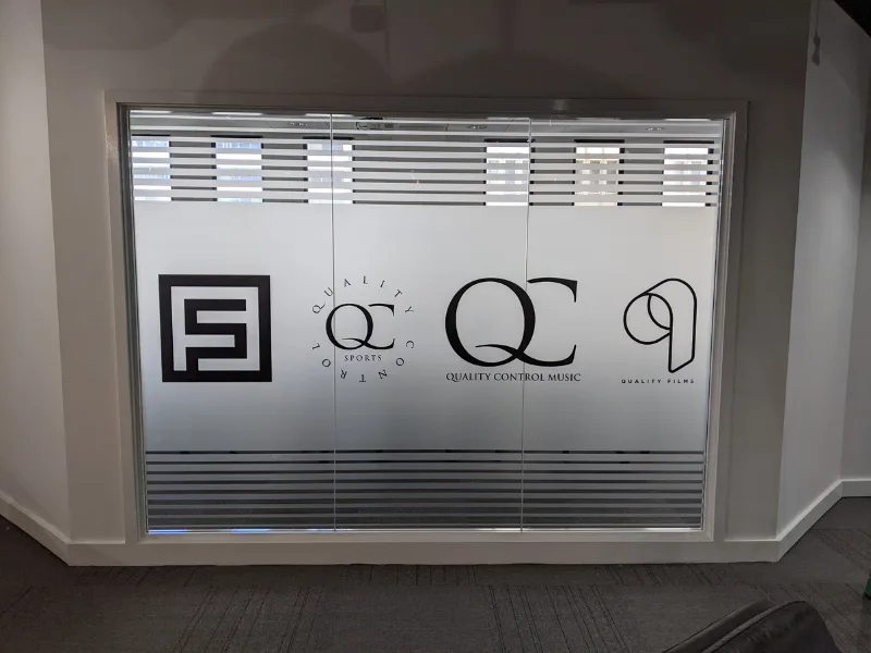 Front window with frosted film and company logos